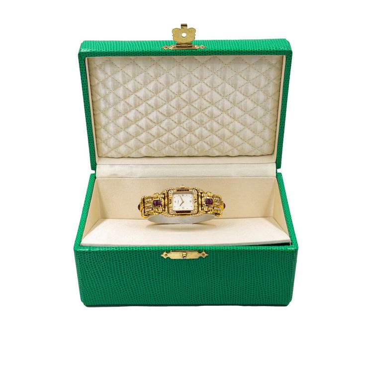 Pre-owned in very good condition Lady’s Tabbah Saga de Tabbah collection known for its unique and modern style, this amazing Swiss-made watch features an elegant rectangular case crafted from precious 18K Yellow Gold and measures approximately 25mm (from end of case to end of crown) x 6.5mm (high). The case is topped with an amazing Diamond-studded 18K Yellow Gold bezel and Rubies approximately 4.87 cts. Behind the high-quality crystal is a superb White guilloche dial with applied dots hour mark Rectangular Yellow Gold Evening Watch, Yellow Gold Rectangular Evening Watches, Evening Yellow Gold Rectangular Watches, Elegant Rectangular Gold Jewelry And Watches, Elegant Rectangular Jewelry And Watches For Evening, Classic Formal Watch With Rectangular Case, Classic Formal Watches With Rectangular Case, Evening Yellow Gold Diamond Watch With Rectangular Dial, Classic Rectangular Case Watches For Formal Occasions