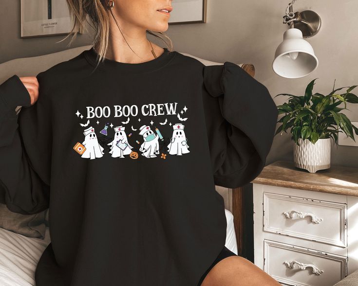 Boo Boo Crew Nurse Shirt, Halloween Nurse Sweatshirt,Halloween Shirt, Ghost Shirt, Ghost Nurse Shirt, Halloween Nurse Crew Shirt, Nurse Gift Attention! This listing includes sweatshirts, hoodies, and t-shirts for adults, youth, and toddlers. Please make sure that you select right size. Thank you! :) While our standard processing time falls within 1 to 2 business days, you can count on us to have your shirt printed on the same day of your order placement. Here's what you can expect from our shirt Pre-shrunk Long Sleeve Halloween Shirt, Black Long Sleeve Halloween Shirt, Spooky Long Sleeve Shirt For Halloween, Halloween Long Sleeve Shirt With Letter Print, Long Sleeve Shirt With Halloween Character Print, Spooky Long Sleeve Shirt With Letter Print, Pre-shrunk Long Sleeve Shirt For Halloween, Long Sleeve Shirt With Letter Print In Spooky Style, Long Sleeve Halloween Shirt