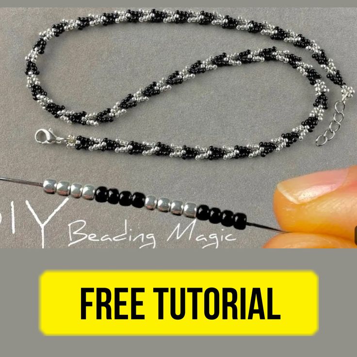 a hand holding a bead necklace with black beads on it and the text, diy beading magic