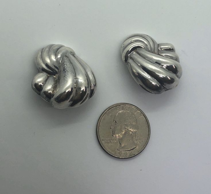 "10% OFF SALE when you spend $49.99 Fully Guaranteed & Free Shipping in the United States This is a beautiful vintage pair of sterling silver abstract earrings are in good condition. Clip On Earrings Sterling Silver Abstract Earrings 1 1/4\" L X 1\" W Marked 925 10g Pictured next to a US quarter to show relative size. Please see photos for detail. Fully guaranteed. To view more of our Screwbacks & Clip Ons click here: https://www.etsy.com/shop/DPSDeadPeoplesStuff?ref=seller-platform-mcna Silver Earrings Aesthetic Vintage, Jewellery Content, Silver Earrings Aesthetic, Vintage Silver Earrings, Earrings Aesthetic, Costume Jewelry Rings, Abstract Earrings, Chunky Earrings, Chunky Jewelry