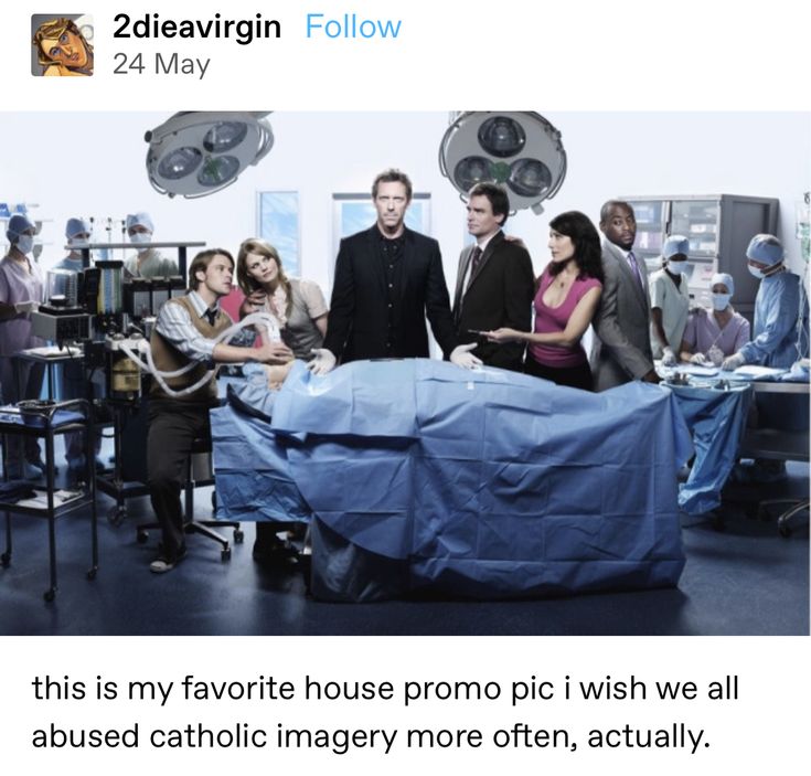 a group of people standing around a hospital bed