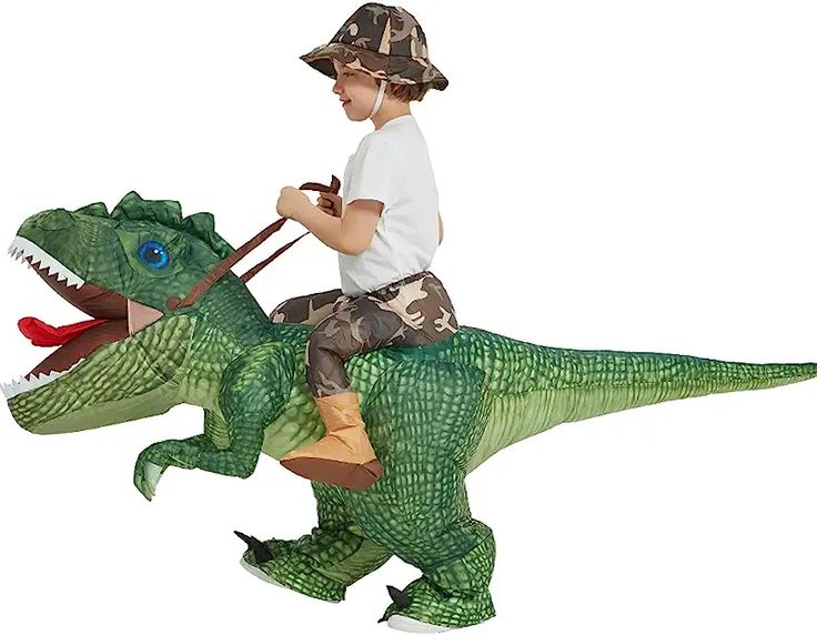 a young boy riding on the back of a toy dinosaur