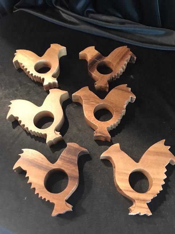 several pieces of wood carved to look like birds