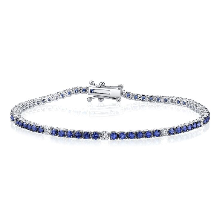 Over four carats of round blue sapphires are accented by eight white diamond stations in this unexpected combination of hues. Sophisticated and elegant, this piece can be worn on it's own or pairs nicely with tennis bracelets of all colors. Sapphire Tennis Bracelet, Sapphire Tennis Bracelet With Diamond Accents, Luxury Sapphire Classic Tennis Bracelet, Silver Sapphire Tennis Bracelet, Elegant Blue Sapphire Tennis Bracelet, Luxury Silver Sapphire Tennis Bracelet, Emerald Bracelet, Sapphire Bracelet, Tennis Bracelet Diamond