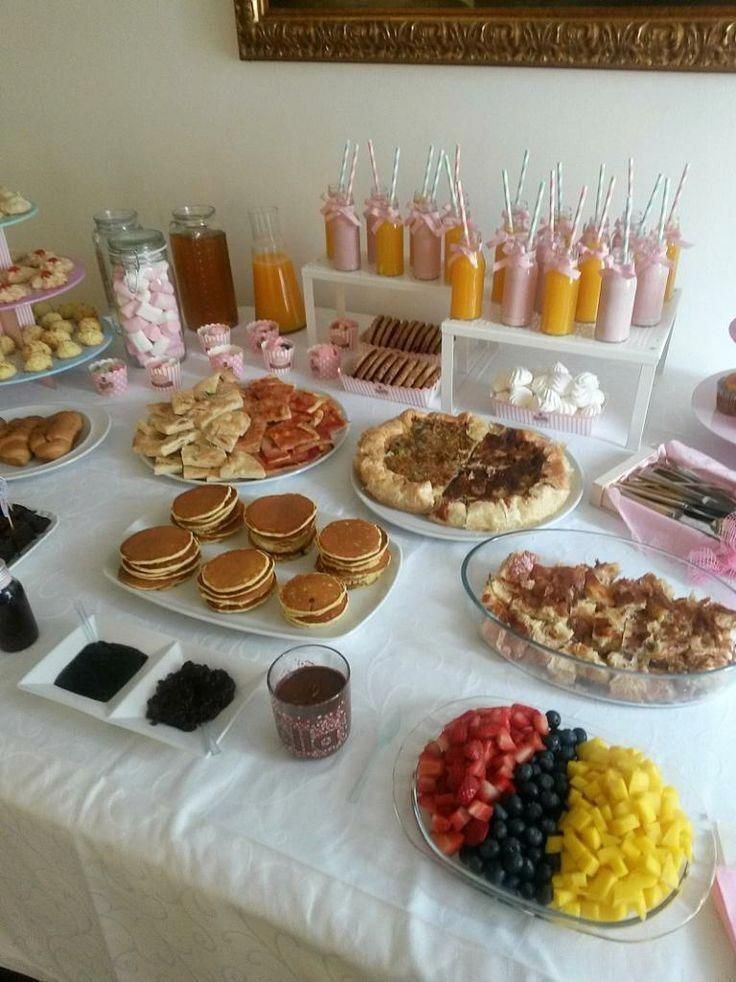 a table topped with lots of desserts and pastries