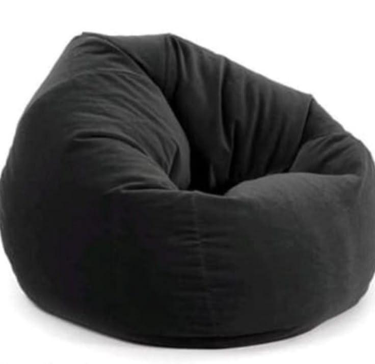 a black bean bag chair sitting on top of a white floor