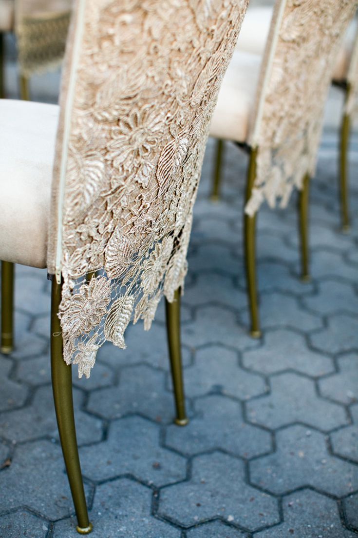 there are many chairs with lace on them