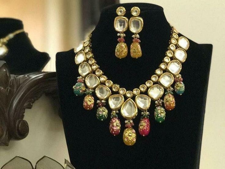 Tanjore kundan necklace set, simple kundan set, multi color kundan set, meena kundan necklace set, Indian kundan jewellery Product Description: * Tanjore kundan necklace set, simple kundan set, multi color kundan set, meena kundan necklace set, Indian kundan jewellery * The base metal color is Gold tone studded with kundan along with beads work on it. * This Jewelry set would add more charms to your beautiful jewelry collection and would surely bring lots of compliments . * Note:- This is an art Indian Kundan Jewellery, Necklace Set Simple, Artificial Jewelry, Kundan Necklace Set, Necklace Set Indian, Beads Work, Kundan Set, Plastic Pouch, Kundan Necklace