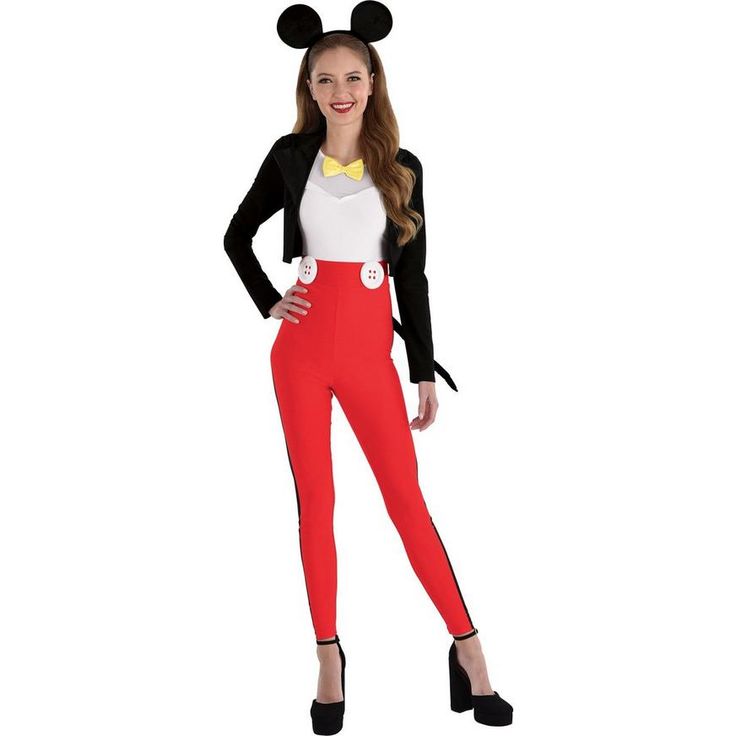 a woman in mickey mouse costume posing for the camera with her hands on her hips