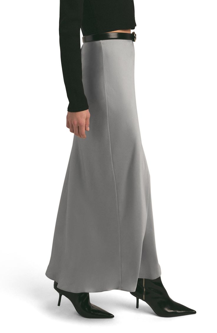 This curve-hugging maxi skirt is a sleek and modern addition to your everyday wardrobe. 39" center front length (size Medium) Lined 100% polyester Dry clean or machine wash, line dry Imported Elegant Fitted Floor-length Maxi Skirt, Fitted Floor-length Maxi Skirt For Formal Occasions, Formal Fitted Floor-length Maxi Skirt, Solid Stretch Maxi Skirt, Chic Full-length Stretch Skirt, Chic Stretch Full-length Skirt, Fitted Modern Maxi Skirt With Lined Skirt, Fitted Modern Lined Maxi Skirt, Chic Full Length Stretch Skirt