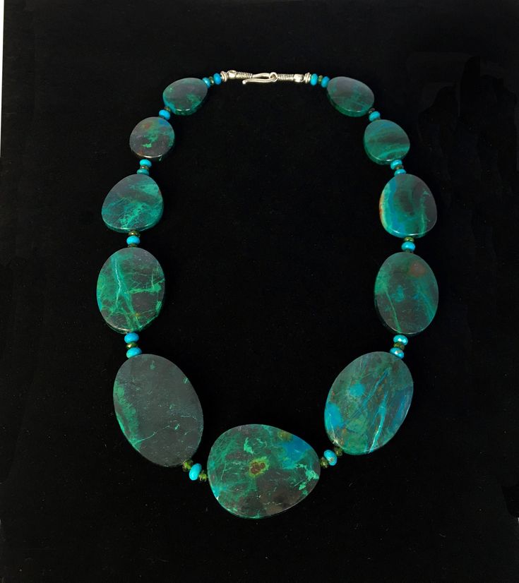 "If you like stunningly beautiful gemstone jewelry that makes a statement then you will love this Chrysocolla necklace with its bold and big oval free form nuggets along with the accents of the Green Chrome Diopside and the Turquoise rondelles that gives this handcrafted piece its powerful presence. It's a \"piece de resistance\" that will transform any ensemble from \"meh\" to \"marvelous\"! The big stones are so smooth and comforting to touch and wear....this is a \"one of a kind\" necklace... Silver Statement Necklace, Green Chrome, Silver Necklace Statement, Sherman Oaks, Turquoise Necklace, Gemstone Jewelry, Necklace Etsy, Statement Necklace, Beaded Necklace