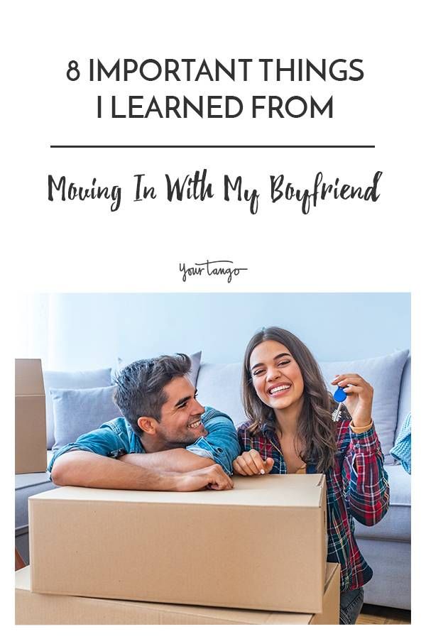 a man and woman sitting on top of a moving box with the text 8 important things i learned from moving in with my boyfriend