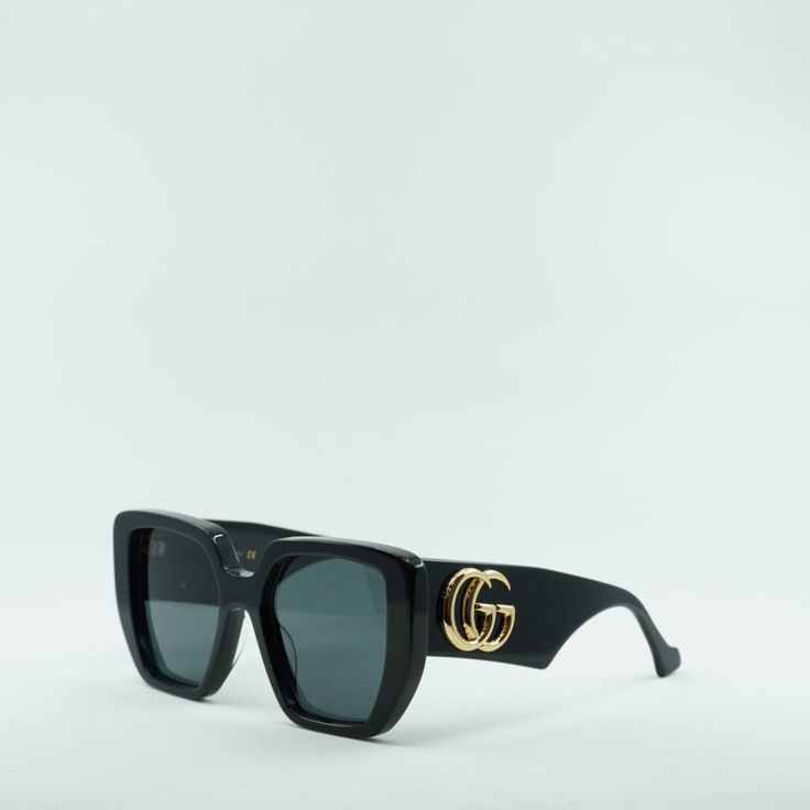 Welcome to OSSA FRAMES, where luxury meets style with the Gucci GG0956S 003 Black/Grey sunglasses. Designed by the iconic fashion house Gucci, these sunglasses are the perfect accessory for any fashion-forward woman. Crafted with precision and attention to detail, these sunglasses feature a sleek black acetate frame that exudes sophistication. The square shape adds a modern touch, while the full rim design provides a classic look that never goes out of style. The grey lenses offer 100% UV protec Designer Cat Eye Tinted Sunglasses, Designer Cat Eye Sunglasses With Mirrored Square Frame, Designer Square Frame Cat Eye Sunglasses With Mirrored Lenses, Gucci Designer Shield Sunglasses With Uv Protection, Luxury Shield Sunglasses With Tinted Square Frame, Chic Gucci Cat Eye Sunglasses, Trendy Gucci Cat Eye Tinted Sunglasses, Trendy Gucci Cat Eye Square Frame Sunglasses, Trendy Gucci Square Frame Cat Eye Sunglasses