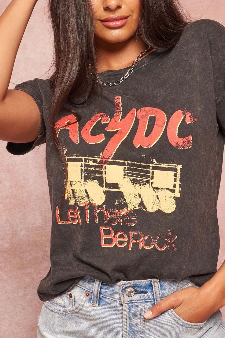 Mineral-washed graphic t-shirtVintage-style AC/DC logo print with guitar graphic and "Let There Be Rock" text.Round neckline.Short drop-shoulder sleeves.Loose fit.100% Cotton.Imported top designed and printed in Los Angeles, CA.Officially ... Edgy Washed Black T-shirt With Letter Print, Trendy Acid Wash T-shirt For Concert, Trendy Band Logo T-shirt For Concerts, Distressed Rock T-shirt For Streetwear, Summer Rock T-shirt With Band Logo, Rock Style Graphic Print T-shirt For Summer, Rock Style Crew Neck T-shirt With Letter Print, Edgy Tops For Music Festivals, Edgy Graphic Print Tops For Music Festivals