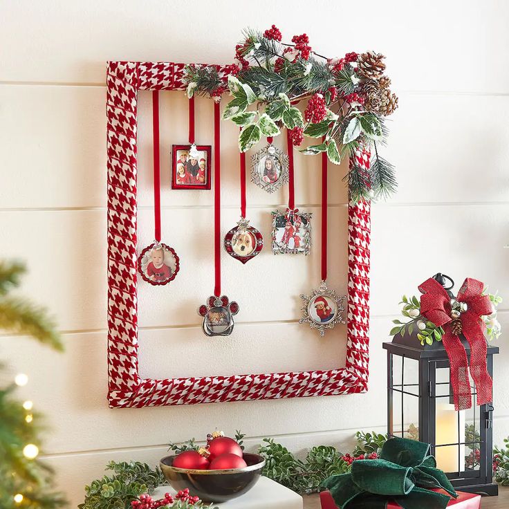 a christmas display with ornaments hanging on the wall