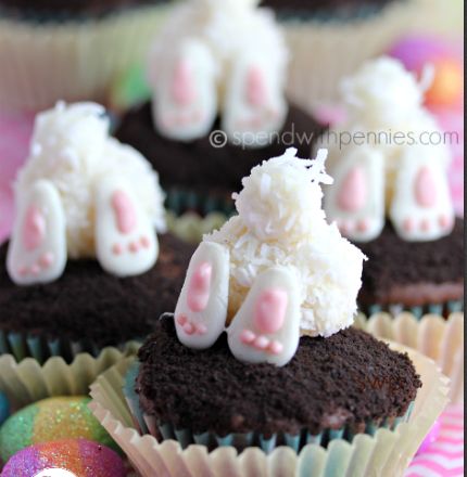 bunny cupcakes with chocolate frosting and white icing on top are ready to be eaten