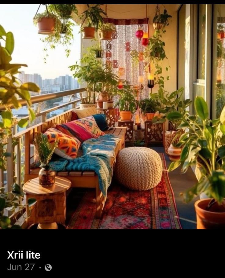 a balcony with potted plants and pillows on it