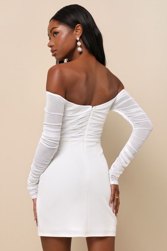 You're sure to be the center of attention any evening with the romance-ready look of the Lulus Elegant Eternity White Mesh Ruched Off-the-Shoulder Mini Dress! This trendy little number features stretchy sheer mesh (atop a matching knit liner) that shapes a ruched bodice and an off-the-shoulder neckline with hidden no-slip strips, all framed by long ruched sleeves. The high, fitted waist tops a crepe knit bodycon skirt that ends at a flirty mini hem. Hidden back zipper/clasp. Fit: This garment fi Flirty Off-shoulder Mini Dress With Ruched Bodice, Fitted Off Shoulder Dress With Ruched Bodice For Party, Fitted Off-shoulder Dress With Ruched Bodice For Parties, Fitted Flirty Off-shoulder Dress For Evening, Fitted Flirty Off Shoulder Dress For Evening, Elegant Off-shoulder Dress With Ruched Bodice For Parties, Elegant White Ruched Off Shoulder Dress, Flirty Fitted Off-shoulder Dress With Ruched Detail, Flirty Fitted Off Shoulder Dress With Ruched Detail