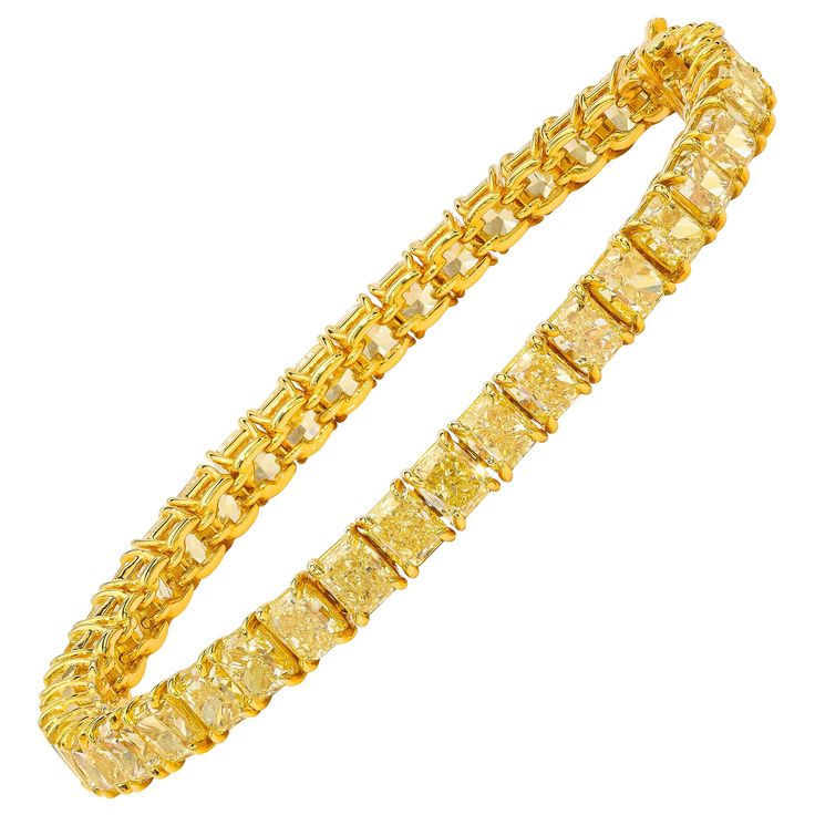 This beautiful tennis bracelet features 42 perfectly matched Fancy Yellow Cushion Cut Diamonds set in a single line bracelet. Measure 6.75 inches. Set in 18 Karat Yellow Gold. Money And Jewelry, Yellow Diamond Bracelet, Jewellery Campaign, Canary Diamond, Yellow Cushion, Platinum Bracelet, Gold Money, Modern Bracelets, Fancy Yellow Diamond