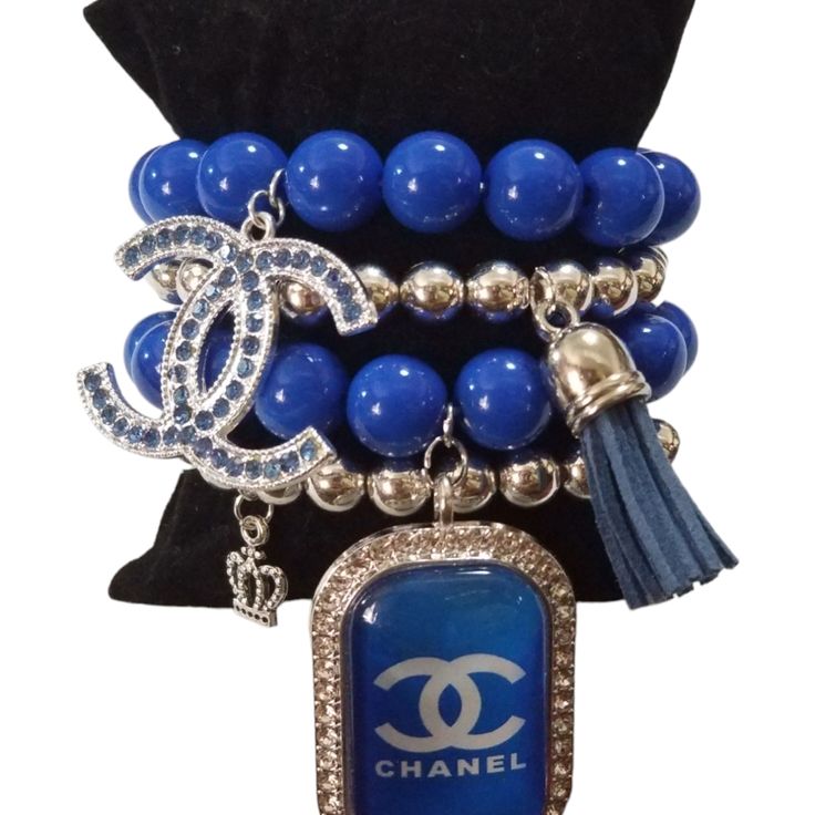 This Fashion Designer Charm Bracelet Is A Must-Have For Any Jewelry Collection. With A Stylish Round Shape And A Slide Closure, It Is Perfect For Any Occasion Like Engagement, Graduation, Or Anniversary. The Bracelet Is 7.5 Inches In Length And Consists Of 4 Stackable Units, Each Handmade With Blue And Silver Beaded Charms. The Bracelet Is Customized With A Glam Theme And Features No Main Stone Or Gemstones. It Is Signed By Ashleymarieboutique And Comes With No Seller Warranty. This Charm Bracel Blue Adjustable Charm Bracelet For Party, Adjustable Blue Charm Bracelet For Party, Adjustable Blue Charm Bracelet For Parties, Blue Charm Bracelet For Party, Elegant Blue Metal Beaded Bracelets, Elegant Blue Beaded Metal Bracelets, Beaded Charms, Jewelry Organizer Diy, Creating Jewelry