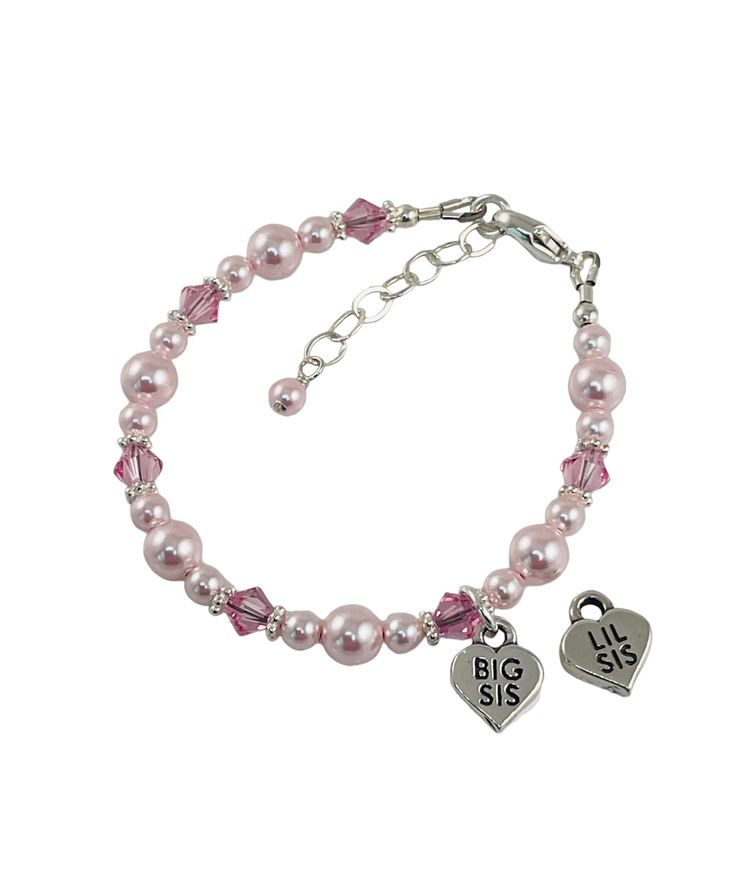 This beautiful bracelet features crystal light pinks and light rose PRESTIGE Crystal s pearls (Rosaline), sterling silver beads, bali beads, sterling silver chain and sterling silver big sis heart Charm. The bracelet come with a one inch extender but can be adjusted to fit. All metal findings are solid sterling silver. Available on White and Cream. Your child's bracelet will be custom sized according to her age or size do you like, please include in your check out notes for expedited delivery. Pink Heart Beads Bracelets For Mother's Day, Pink Bracelet Jewelry For Birthday, Pink Heart Beads Bracelets For Birthday, Pink Beaded Heart Bracelet For Mother's Day, Hypoallergenic Pink Jewelry For Birthday, Pink Heart Beads Bracelet For Birthday, Nickel Free Pink Bracelets For Mother's Day, Pink Pearl Beaded Bracelet For Birthday, Personalized Pink Heart Bracelet For Birthday