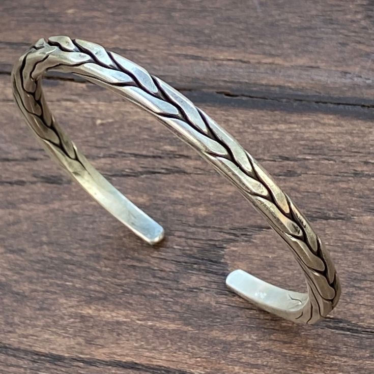 ❋ Handmade Sterling Silver Flexible Braided Cuff Bracelet, Natural look, for Man or Woman ❋Adjustable, Flexible, The Length end to end from the outside) about 6 7/8 inches ( / 17.5cm). ❋Size: M-L for women, S-M for men ❋ Metal Purity: 95% Silver. (Purer than 925 Sterling Silver). We also have Braided Silver Matching Earrings and Rings To browse some more of our silver jewelry collection you can click on the following links: https://www.etsy.com/shop/SilverShapes Earrings: https://www.etsy.com/sh Traditional Adjustable Engraved Braided Bracelet, Adjustable Artisan Sterling Silver Bangle Bracelet, Handmade Adjustable Sterling Silver Artisan Bracelet, Artisan Cuff Bracelets With Adjustable Fit, Traditional Adjustable Engraved Braided Bracelets, Adjustable Oxidized Finish Bracelets For Festival, Artisan Adjustable Cuff Bracelet, Adjustable Bohemian Sterling Silver Bangle Bracelet, Adjustable Bohemian Sterling Silver Bracelet