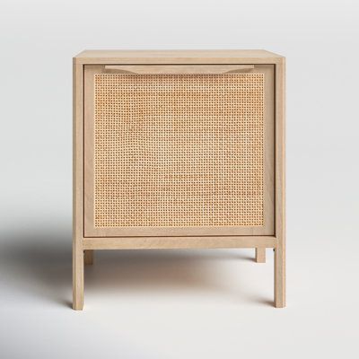 the side table is made out of wood and has a rattan pattern on it