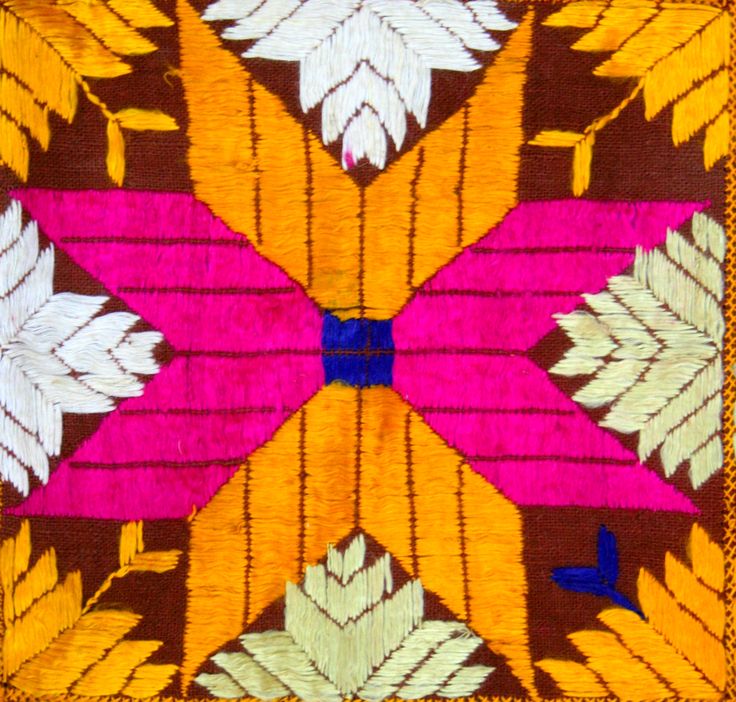 an orange, pink and yellow pattern with white leaves on the center is featured in this image