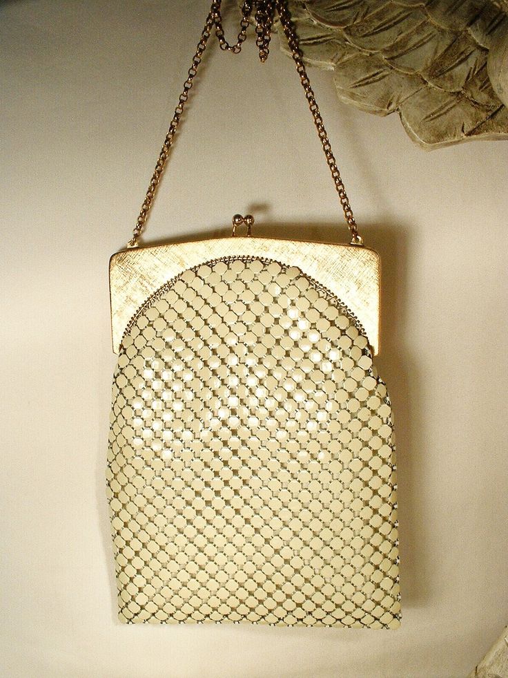 Offering a gorgeous vintage 1940s - 1950s era warm ivory/light champagne mesh Art Deco flapper purse made by Whiting & Davis in near PRISTINE vintage condition and perfect for the Bride! If you've ever seen one of these purses in person you know just how well made they are. The mesh has a wonderful fluidity and movement so it shimmers as it catches the light. I love the SO 1920's Art Deco flapper design of this one. The frame is a beautiful textured/brushed gold on the front and back and shiny gold along the edges. Photos don't begin to do this bag justice or capture the sparkle of the mesh or frame adequately.  The bag measures 7.5 inches (19.1 cm) high, not counting the clasp, and is 5 1/2 inches (13.9 cm) wide along the bottom so it will easily fit your essentials including your phone. Cream Rectangular Evening Bag, White Vintage Party Bag, Vintage Beige Party Bag, Vintage White Party Bags, Vintage Rectangular Evening Bag, Vintage Cream Bags For Vintage Events, Elegant White Evening Bag For Vintage Events, Vintage Evening Bag For Vintage Events, Elegant Beige Bag For Vintage Events