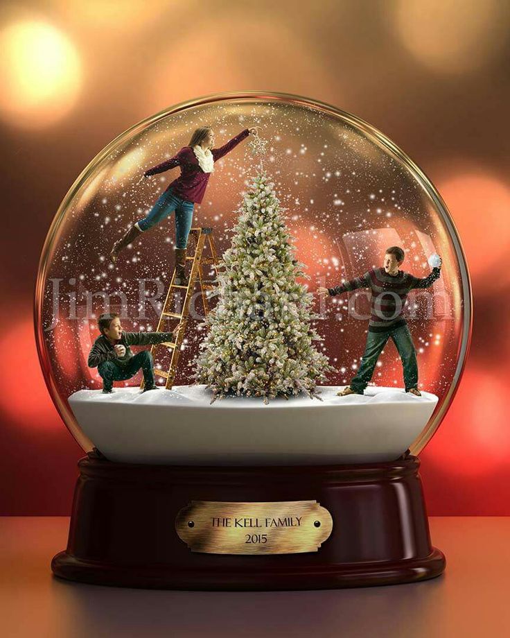 a snow globe with three figurines on top of it and a christmas tree in the middle