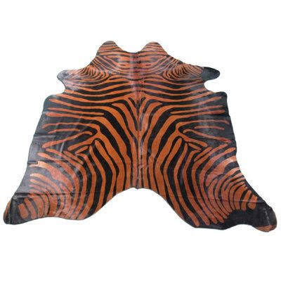 an orange and black animal skin rug on a white background with the image of a zebra's head