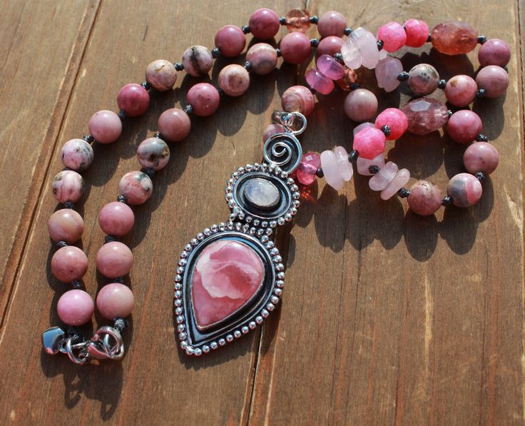 The allure of Rhodochrosite is undeniable, both for its raspberry-pink to rose-red color and for the pulsating electrical energy of love it emits. Rhodochrosite emanates one of the most tender and loving energies of any stone, soothing the heart, comforting the soul, and vibrating to the frequencies of inner peace. It is a marvelous talisman of joy and healing, embracing one's rightful powers and rising to one's full potential. Enchanting Rhodochrosite Hand knot beaded necklace has stones of Rho Spiritual Gemstone Beads Jewelry For Valentine's Day, Pink Bohemian Jewelry For Valentine's Day, Bohemian Pink Jewelry For Valentine's Day, Pink Rose Quartz Necklace With 8mm Beads, Hand-strung Pink Rose Quartz Necklace, Pink Hand-strung Necklace As Gift, Pink Hand-strung Necklace For Gift, Pink Rose Quartz Spiritual Beaded Necklace, Pink 8mm Beads Jewelry For Meditation