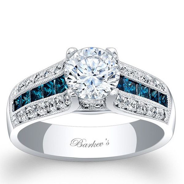 a diamond and blue sapphire engagement ring with the name baron's written on it