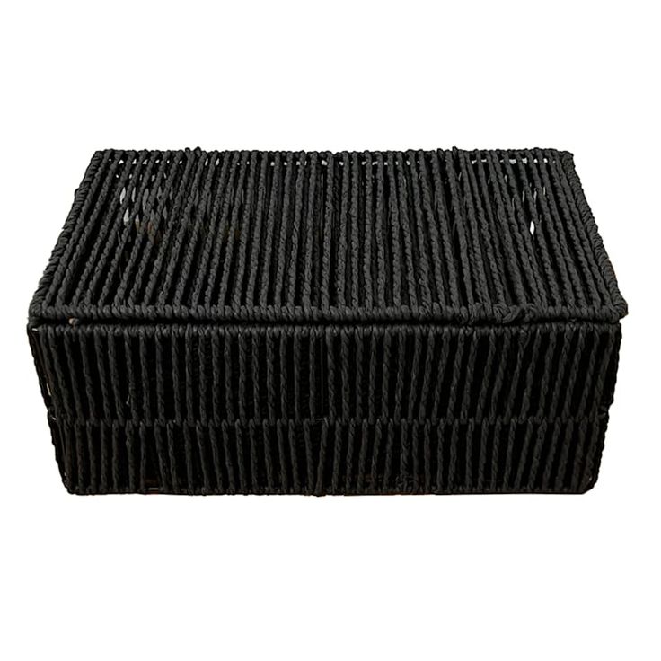 a black basket sitting on top of a white surface