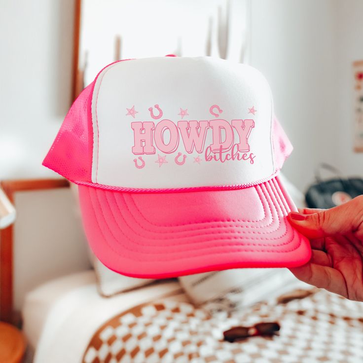 "Introducing the ultimate party accessory for bachelorette festivities - our Fun Pink Trucker Hat with the cheeky phrase \"Howdy Bitches\" embroidered on it! This vibrant and playful hat is designed to add a splash of fun and attitude to your celebration. Made with a comfortable fit, it features an adjustable snapback or strap closure, ensuring a customized fit for all the bachelorettes in your group. The striking pink color and bold lettering make a statement, letting everyone know it's time to Pink Cowgirl Hat, Austin Bachelorette, Bachelorette Hats, Pink Trucker Hat, Pink Bachelorette, Nashville Bachelorette, Bride Hat, Bold Lettering, Pink Cowgirl