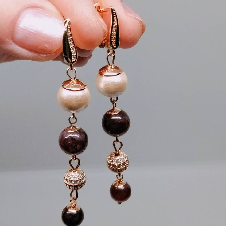 Dangle drop party earrings with garnet, Japanese pearl and gold zirconia beads is 6 cm length made with 14K gold plated zirconia anti-rust hook Elegant Rose Gold Earrings With Dangling Beads, Elegant Brown Chandelier Earrings, Elegant Rose Gold Beaded Dangle Earrings, Elegant Rose Gold Beaded Earrings, Elegant Gold-plated Earrings With Dangling Beads, Elegant Brown Earrings With Dangling Beads, Elegant Brown Beaded Dangle Earrings, Elegant Brown Dangle Earrings, Elegant Long Drop Beaded Earrings