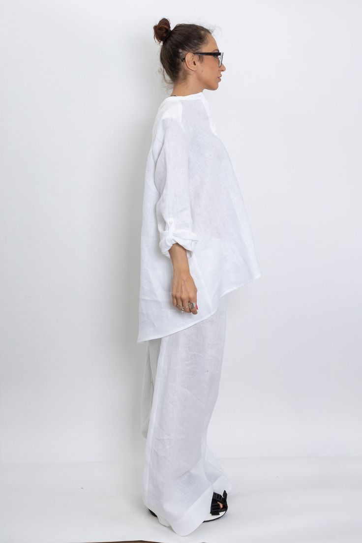 The White linen blouse women is our favorite weekender. Featuring an oversized relaxed fit with front button closing and long sleeves. The long sleeve shirt is made from lightweight linen, that is versatile for any occasion! The White linen blouse women is designed to be comfortable and not troublesome to wear. After wearing this White long sleeve linen shirt women, you will love it even more. ▸FABRIC The white linen blouse women is made from high quality 100% linen ▸SIZING This model linen shir Summer Cotton Blouse With Set-in Sleeves, White Long Sleeve Effortless Top, Effortless White Long Sleeve Top, Non-stretch Long Sleeve Summer Blouse, Casual Long Sleeve Tops With Set-in Sleeves, Casual Long Sleeve Blouse With Set-in Sleeves, Oversized Long Sleeve Shirt For Loungewear, Baggy Long Sleeve Tops, Oversized Cotton Long Sleeve Blouse