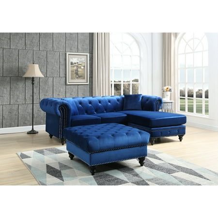 a living room with a blue couch and ottoman