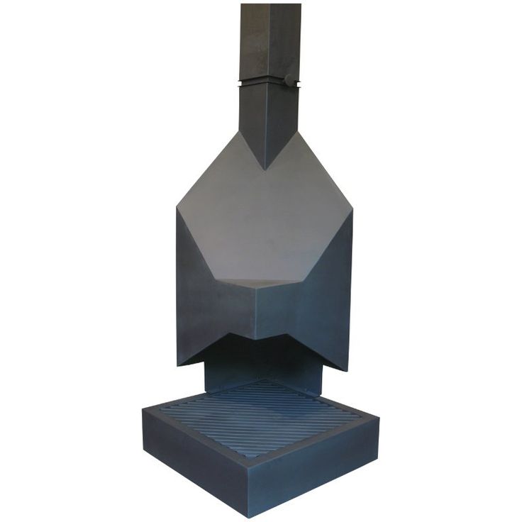 a large metal object sitting on top of a white floor next to a black box