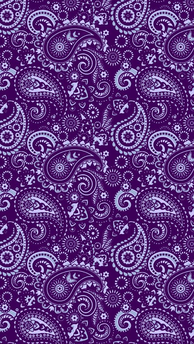 purple and white paisley pattern on a dark background