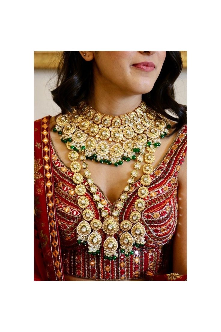 Full bridal Kundan set to enhance your beauty! Saying your vows and taking blessings from your dear ones on your special day! Make your wedding a little more special in our designer bridal set! Trendy, eye catching  choker and long necklace set is handcrafted with shimmering kundan stones, interlaced with pink and mintgreen beads.  The complete bridal set comprises of 9 pcs including a long necklace, a princess necklace, pair of beautiful jhumka earrings with kaan chains, a mathapatti, an armlet Traditional Kundan Bridal Accessories, Traditional Kundan Bridal Accessories For Wedding, Wedding Lehenga With Intricate Kundan Design, Traditional Bridal Sets With Tilla For Marriage, Traditional Kundan Bridal Sets For Marriage, Gold Bollywood Lehenga For Marriage, Bollywood Style Gold Lehenga For Marriage, Traditional Zari Work Sets For Marriage, Festive Lehenga With Zari Work For Marriage