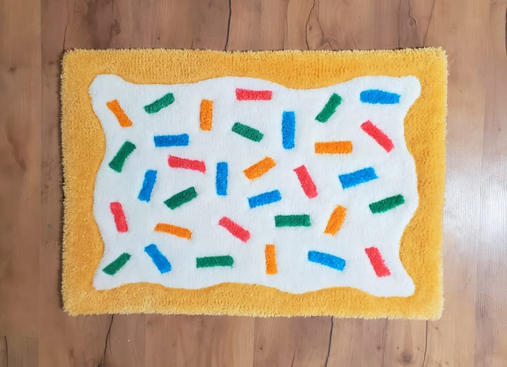 the rug is made to look like it has colorful sprinkles on it