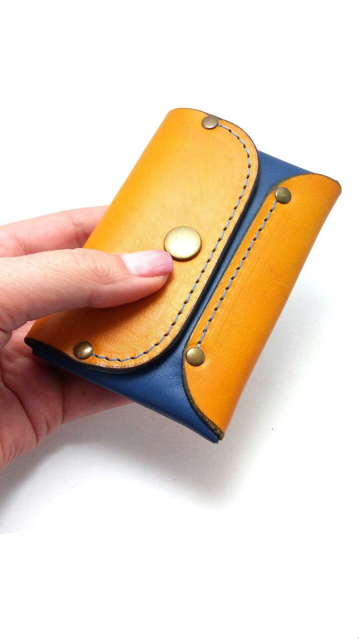 "This original coin purse & wallet is made of blue and orange genuine leather with blue thread. Securely holds 6 -8 cards, bussines cards, ID, some cash and coin . Purse is skillfully handcrafted with genuine 100 % Leather from our hands. The hand stitch is blue coloured waxed thread finished with rivets, which must guarantee for non tearing. Wallet closes with one snaps (press button) This item is an elegant handmade style that suitable for both men and women. Size of the case: closed 8.5 c Blue Rectangular Card Holder For Personal Use, Blue Card Holder With Card Slots, Blue Card Holder With Card Slots For Personal Use, Blue Coin Purse With Card Slots For Gift, Blue Rectangular Coin Purse With Interior Card Slots, Blue Wallet With Card Slots As Gift, Blue Wallet With Coin Pocket As Gift, Handmade Blue Rectangular Wallet, Blue Wallets With Coin Pocket As Gift