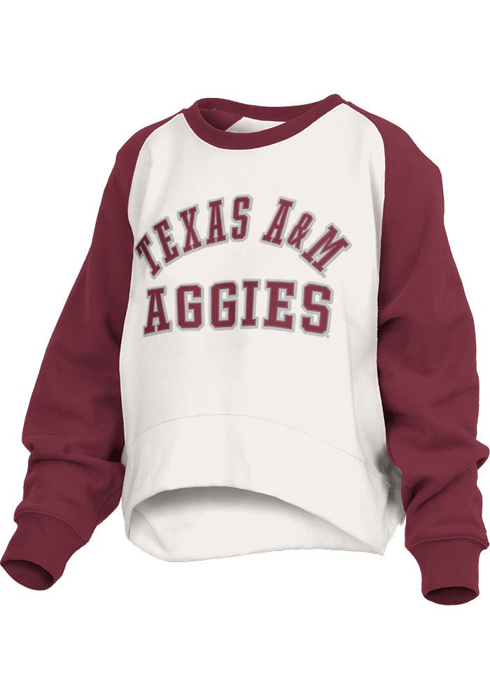 Make your way to the big game in this Texas A&M AggiesWomens White Lotus Crew Sweatshirt! This Aggies Long Sleeve Sweatshirt features a chenille applique team name on center front. Stay warm and comfortable with this Womens Texas A&M Aggies Crew Sweatshirt. Waist length, Contrasting sleeves, Contrasting neckline, Curved hem, Soft to touch, 60% COTTON / 40% POLYESTER, 4 Sports Event Tops With Team Name, Collegiate Tops For Sports Events, White Varsity Sports Fan Top, White Varsity Top For Fan Gear, College Style Sports Tops With Team Name, White College Style Sports Top, Team-colored Tops With Ribbed Cuffs For Fan Gear, Team-colored Tops For Sports Events In Fall, Varsity Tops For Sports Events In Fall