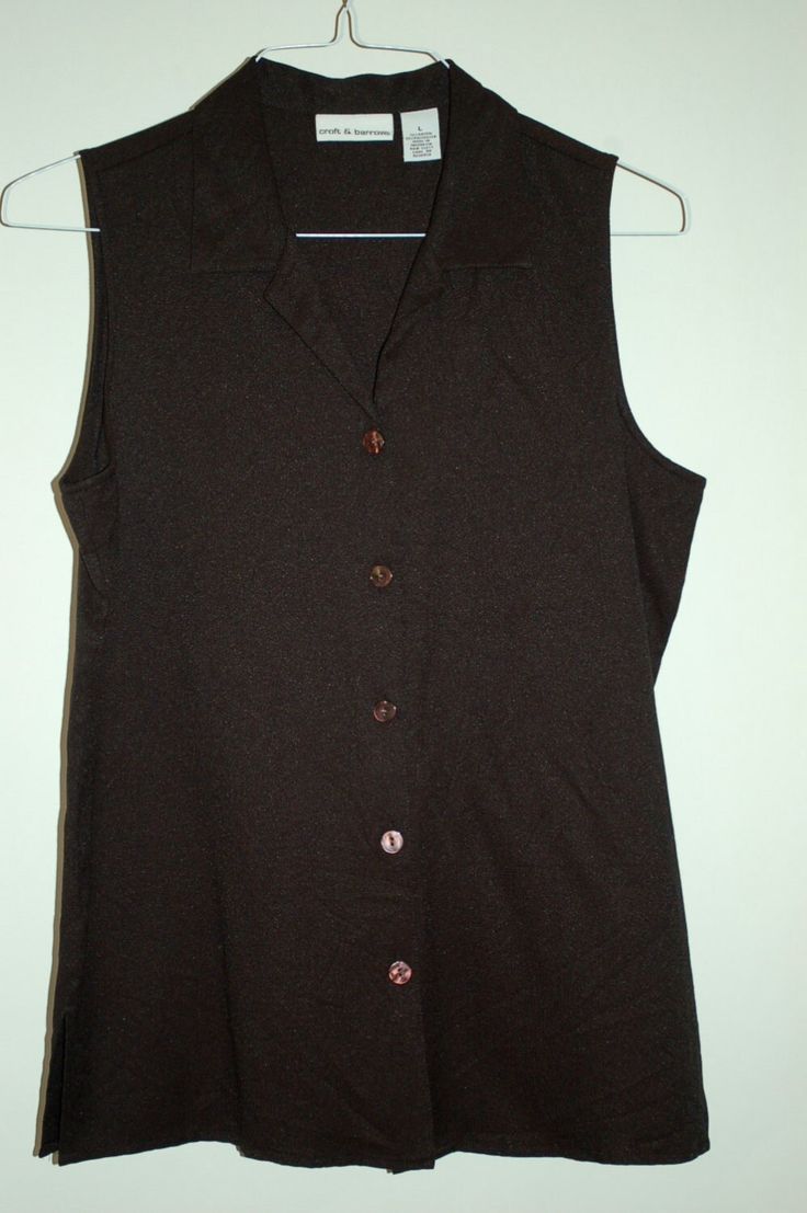 by Croft and Barrows size L rayon blend shoulder to shoulder measured flat 28" underarm to underamr measured flat 40 " overall length 29 inches very solid construction a classic! Fitted Sleeveless Solid Color Blouse, Casual Fitted Sleeveless Blouse, Fitted Sleeveless Top With Buttons, Sleeveless Tops With Buttons For Fall, Sleeveless Brown Cotton Blouse, Brown Sleeveless Cotton Blouse, Fitted Sleeveless Brown Top, Classic Brown Vest Top, Fitted Sleeveless Cotton Blouse