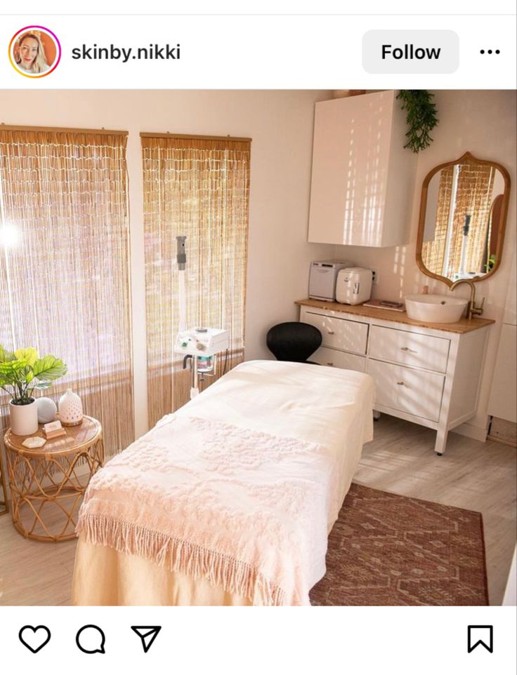 a bed room with a neatly made bed next to a dresser and window sill