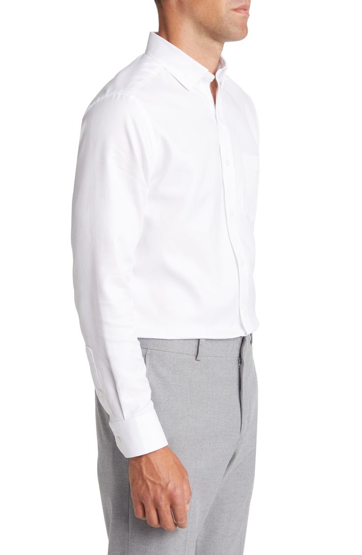 A small bird's-eye weave softly textures a shirt tailored from crisp white cotton in a fit that looks great tucked or untucked. Hidden-button collar Short sleeves 100% cotton Machine wash, dry flat Imported Spring Classic Dress Shirt For Business Casual, Classic Spring Dress Shirt For Business Casual, Classic Linen Shirt For Semi-formal Occasions, Classic Semi-formal Linen Shirt, Classic Button-up Dress Shirt For Spring, Classic Spring Button-up Dress Shirt, Classic Shirt With Welt Pockets, Classic Solid Shirt For Spring, Classic Shirt For Business Casual In Spring