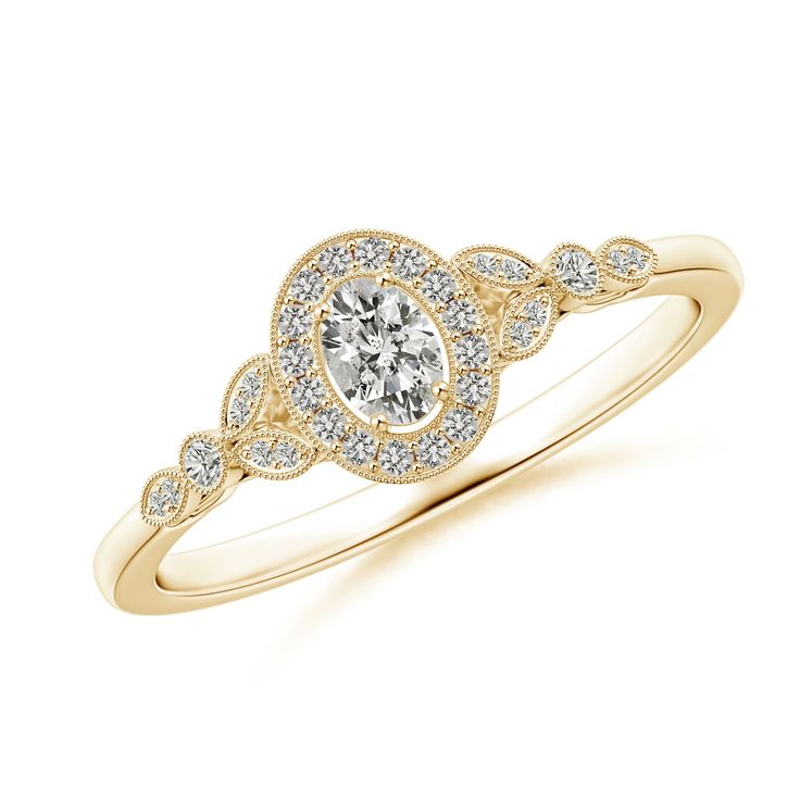 a yellow gold engagement ring with an oval shaped diamond in the center and small pave set diamonds around the band