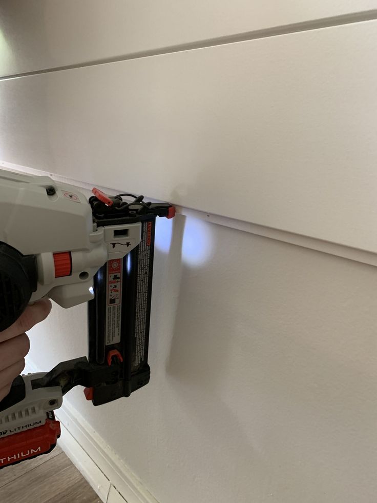 Shiplap Around Corners, White Shiplap Hallway, Trimming Out Shiplap Walls, How To Shiplap A Wall, Shiplap Installation Diy, Installing Shiplap Walls Over Drywall, How To Hang Shiplap Plank Walls, Hanging Shiplap Wall, Half Shiplap Wall With Shelf