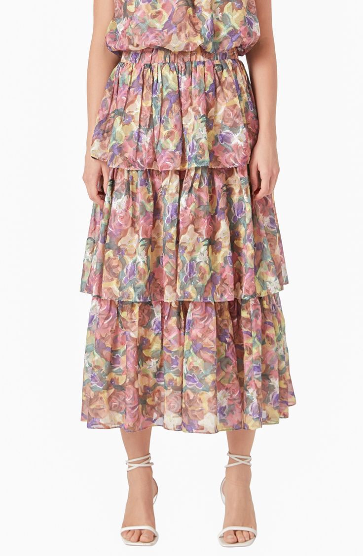 Frothy tiered ruffles romance this chiffon maxi skirt covered in delightful blooms. Elastic waist Lined 100% polyester Hand wash, dry flat Imported Chiffon Maxi Skirt, Tiered Maxi Skirt, Chiffon Maxi, Tweed Dress, Heat Styling Products, Elegant Floral, Romper With Skirt, Dress Cuts, Tiered Skirt